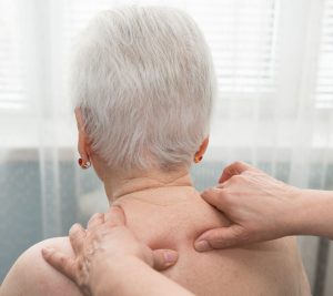 Old woman having a massage